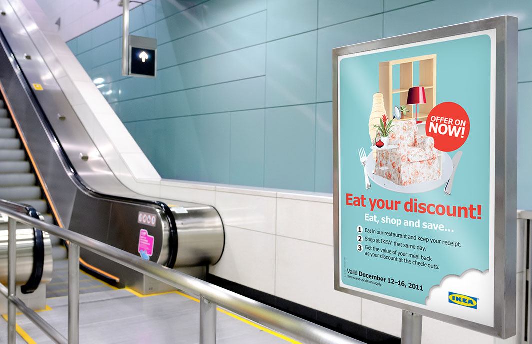 IKEA promotion poster near an escalator.