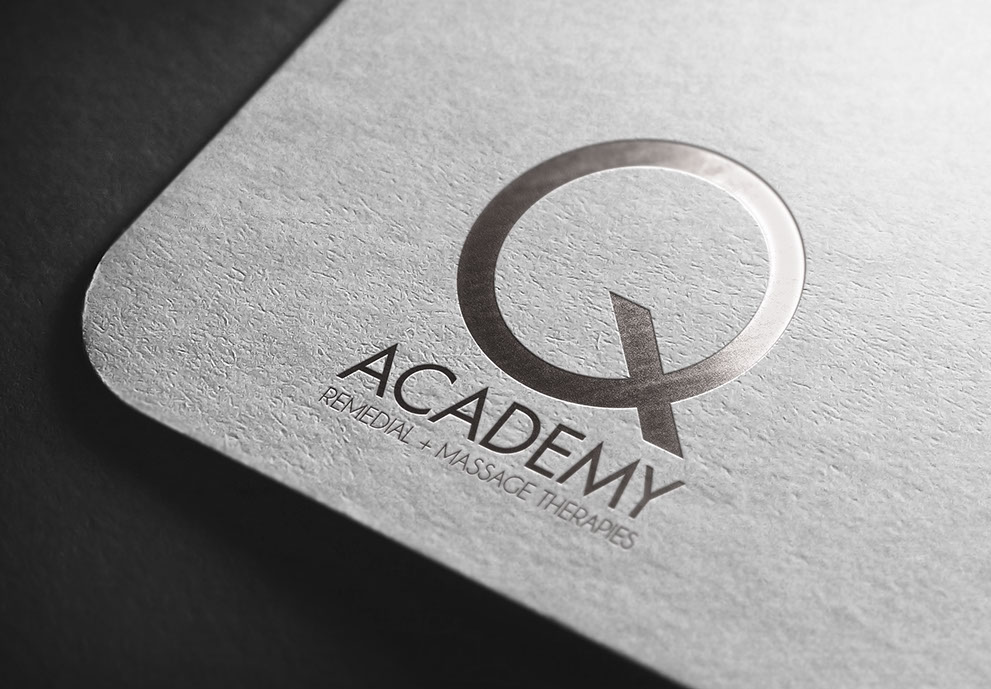 Image of a Q Acadamy business card.