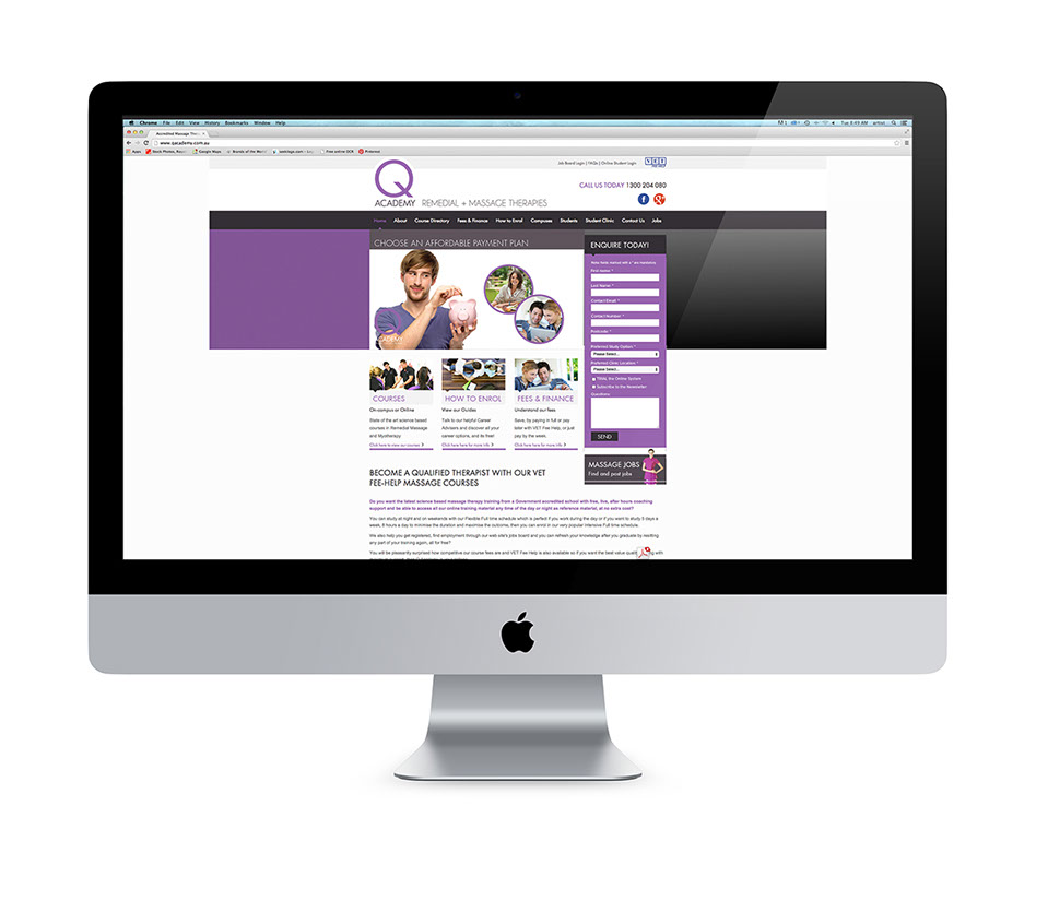 Image of the Q Academy website home page in an iMac screen