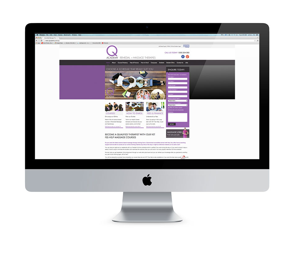 Image of the Q Academy website home page in an iMac screen